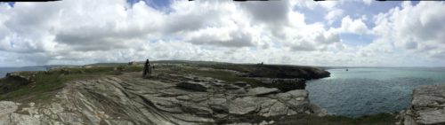 Panorama from the headland of Tintagel island, with new sculpture in mid-ground.