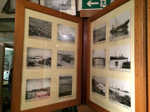 Photographic postcards displayed as museum objects in the Isles of Scilly Museum.
