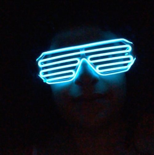 Digital photograph of me wearing neon glasses.