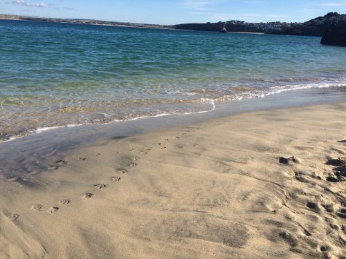 Image of a beach. Relative humidity on a warm sunny day with a light breeze is just about right for humans but can be iffy for some objects